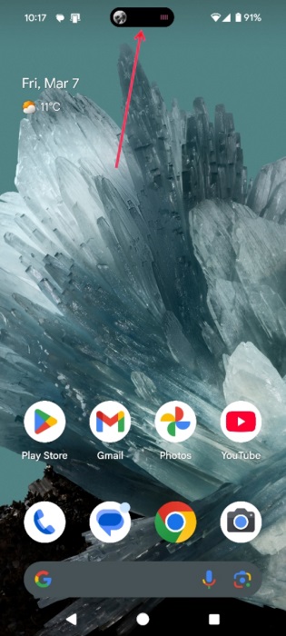 Dynamic Island view from Dynamic Bar app visible while Spotify is playing on Android phone. 
