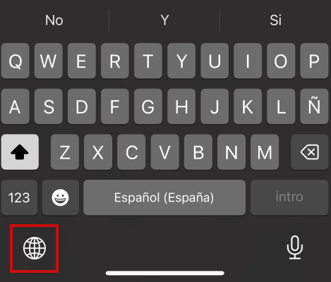 Tapping Globe-like icon in iPhone keyboard to change language. 