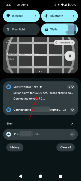 Tapping on alarm notification on Android phone after setting it using Copilot. 