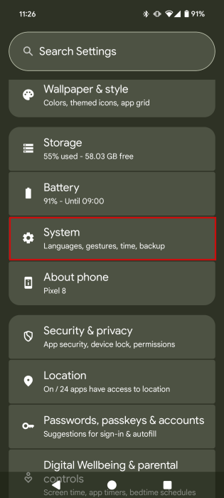 Tapping on "System" in Android settings.