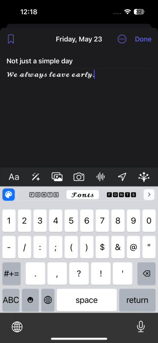 Writing using custom font in Journal app on iPhone.