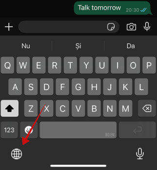 Tapping on globe icon on iPhone keyboard.
