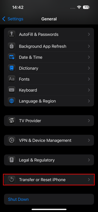Tapping on "Transfer or Reset iPhone" option in iPhone General settings.
