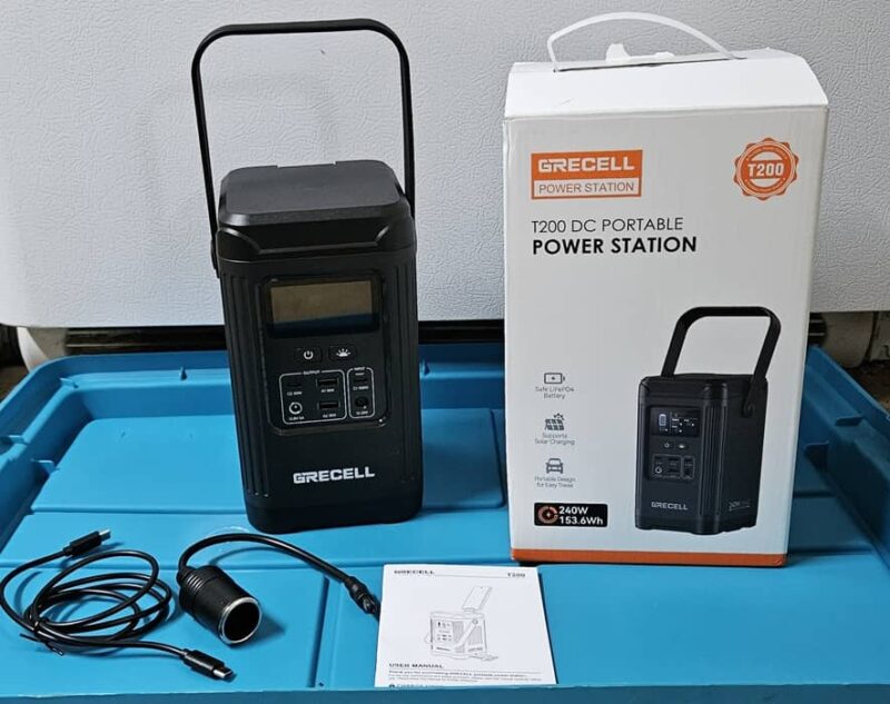 GRECELL with box, manual, and cables.