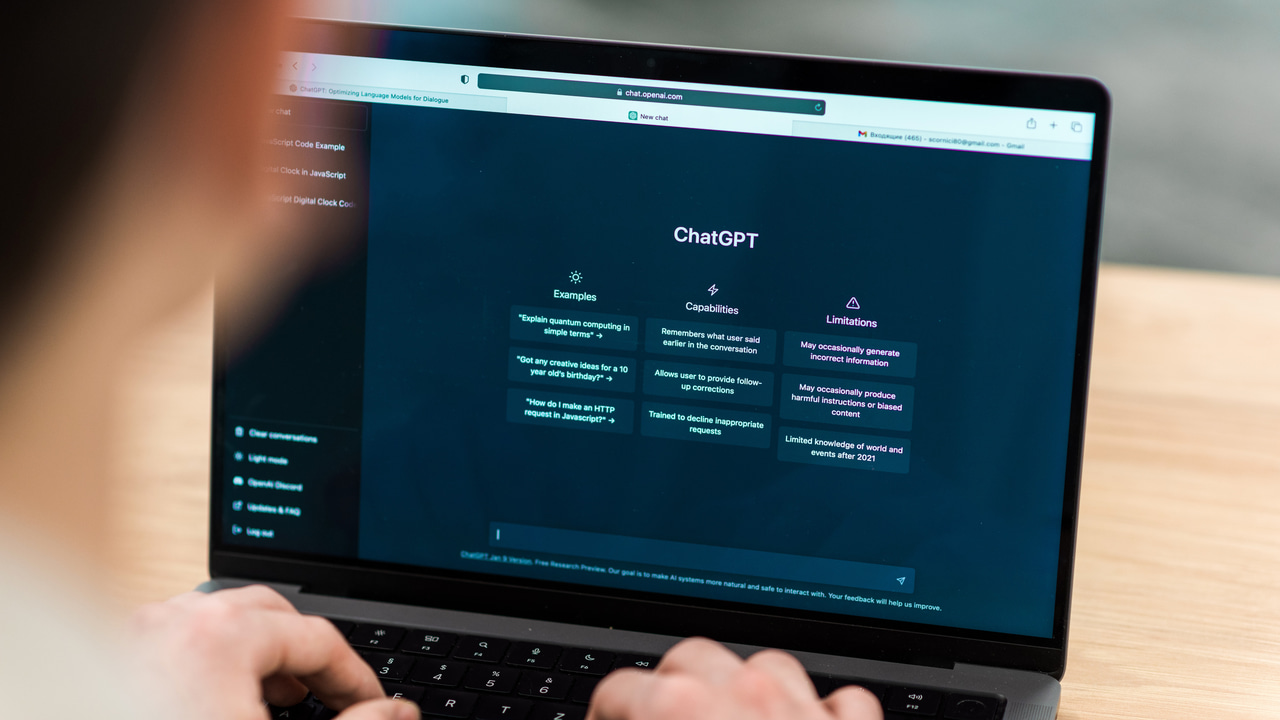 laptop on table with ChatGPT open