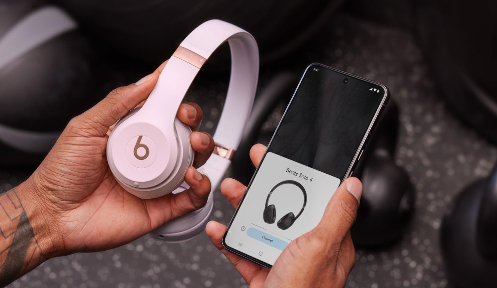 Person Setting Up Beats Headphones to Use With Phone