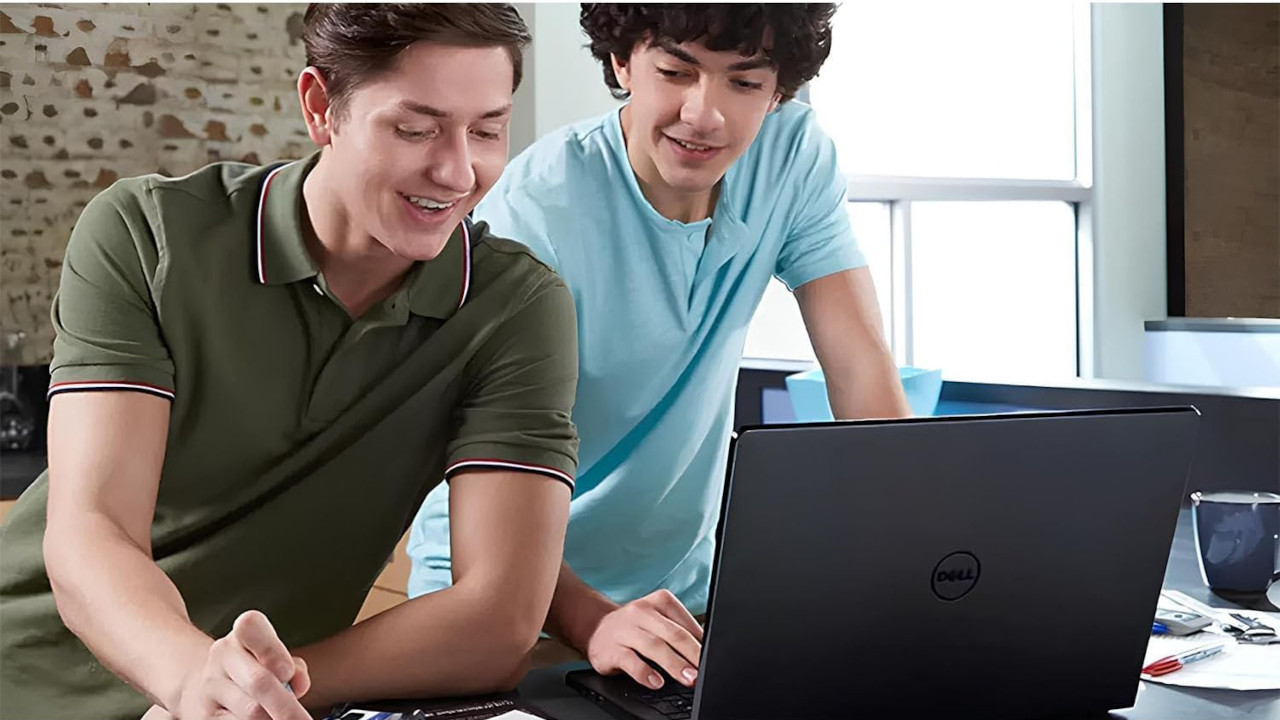 Two Men Using a Dell Laptop to Play a Video Game