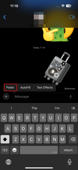Pasting custom emoji in Messages chat on iPhone.