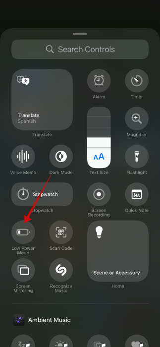 Selecting "Low Power Mode" tile option in Control Center on iPhone. 