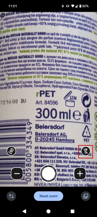 Using Google Magnifier's live camera to view small text on shower gel bottle. 