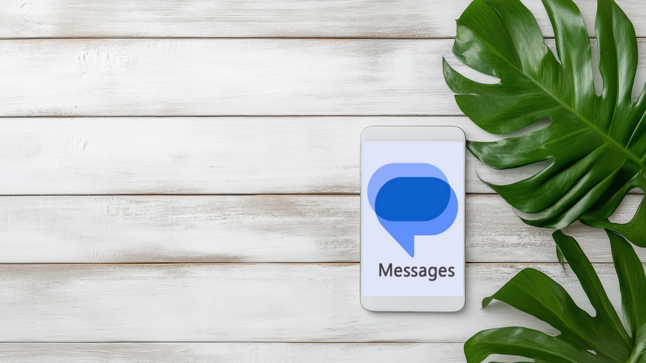 Phone on plain background with leaves and Google messages icon in middle