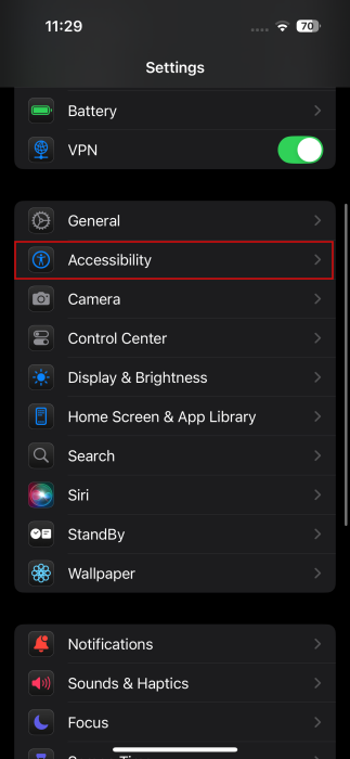 Tapping on "Accessibility" option in iPhone Settings.
