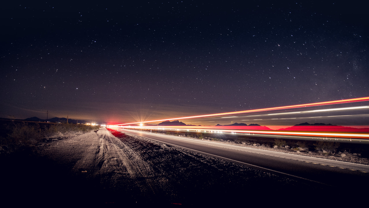 Time lapse photography of vehicles on road