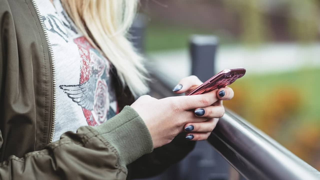 Person using a phone.