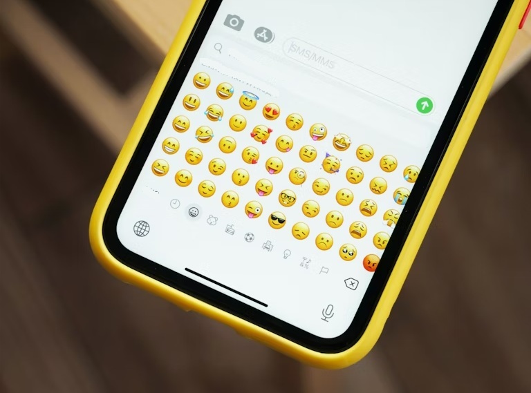 Sending emojis on a phone.