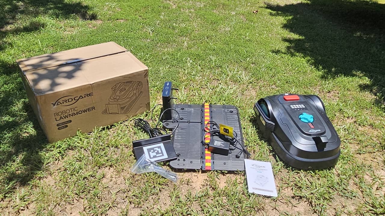 YARDCARE M800PLUS Robotic Lawn Mower with box and accessories.