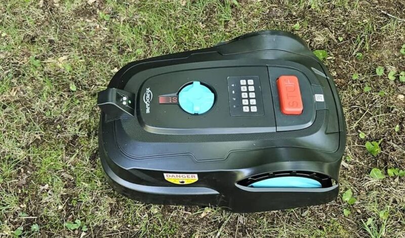 Mower showcasing red stop button.