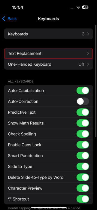 Accessing "Text Replacement" option in iPhone Settings.
