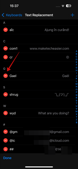 Tapping on "-" sign next to text shortcut on iPhone.