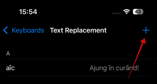 Pressing "+" button to create new text shortcut on iPhone.