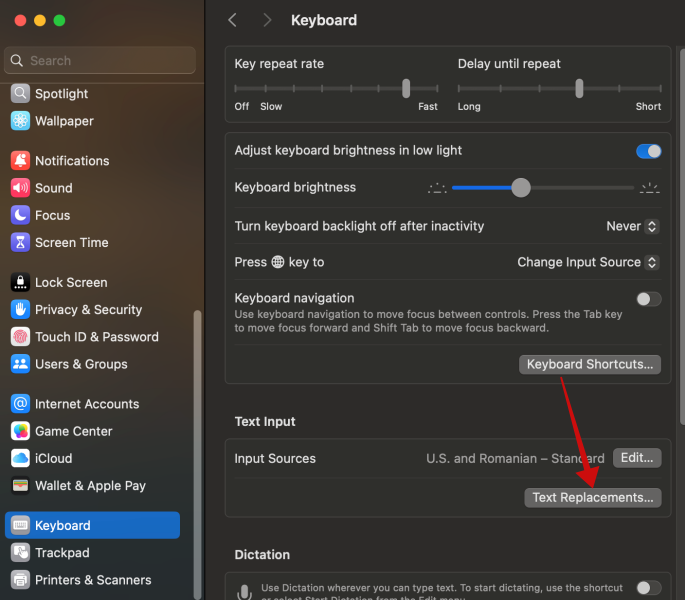Finding "Text Replacement" option under Keyboard in Mac Settings.