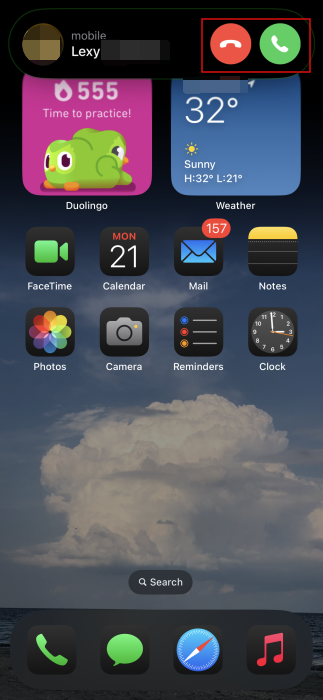 Dynamic Island showing incoming call on iPhone. 