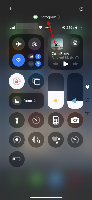 Tapping on top bar in Control Center on iPhone. 