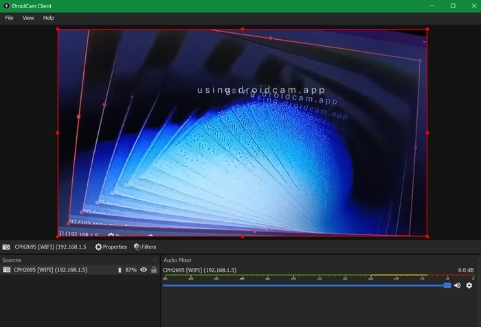DroidCam client in Windows displays a DroidCam Android phone in its lens.