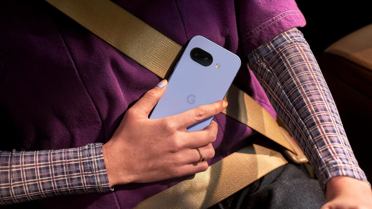 Woman Holding Iris Pixel 9a while in the car