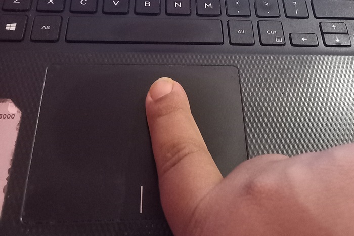 Using an index finger for a one-finger touchpad gesture on a Windows laptop.