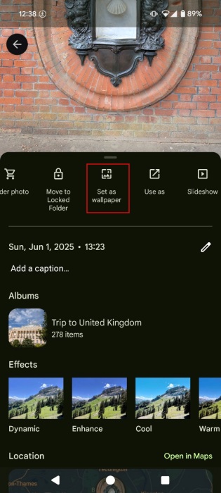 Tapping on "Set as wallpaper" option in Google Photos app. 