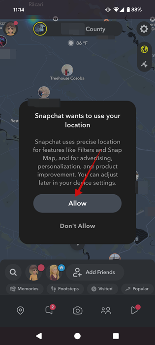 Tapping allow on pop-up in Snapchat app. 