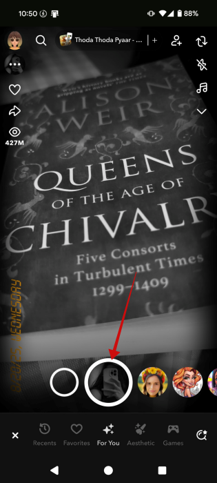 Pressing Shutter button in Snapchat app to snap picture. 