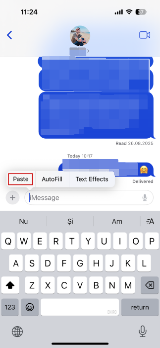 Tapping "Paste" option to bring over sticker from Google Photos to Messages app on iOS.