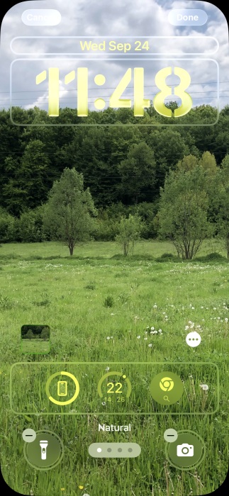 iPhone lock screen view with widgets at the bottom.