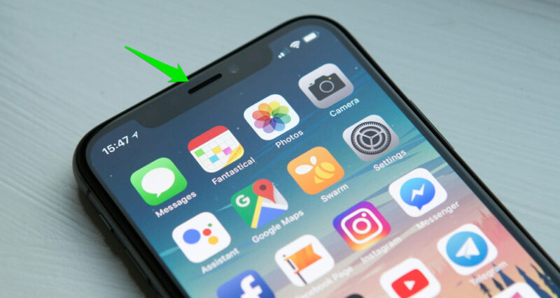 Android phone on table with app icons
