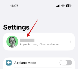 Tapping on name in iPhone Settings. 