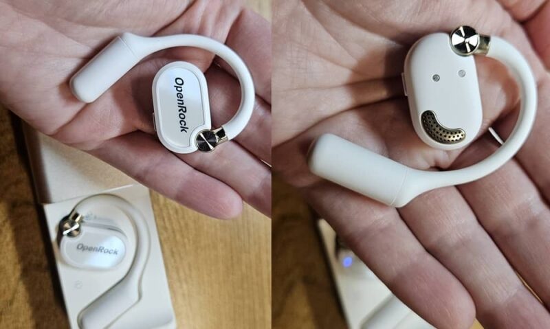 OpenRock X earbuds in hand.