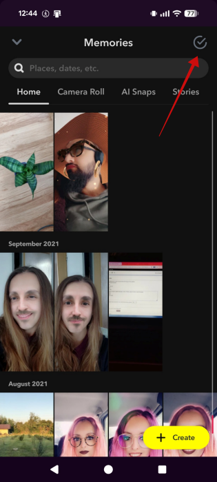 Tapping select icon in Snapchat Memories.