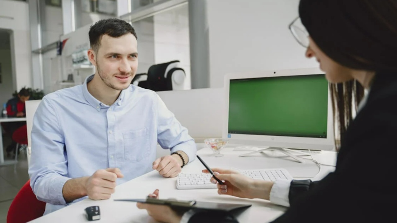 A man applying for a job in person.