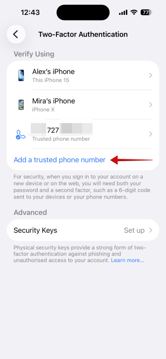Adding a trusted phone number for 2FA on iPhone.
