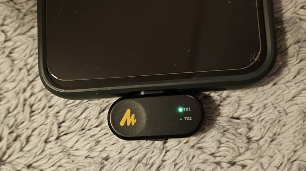 USB dongle fastened to mobile phone phone.