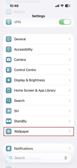 Navigating to "Wallpaper" in iPhone Settings. 