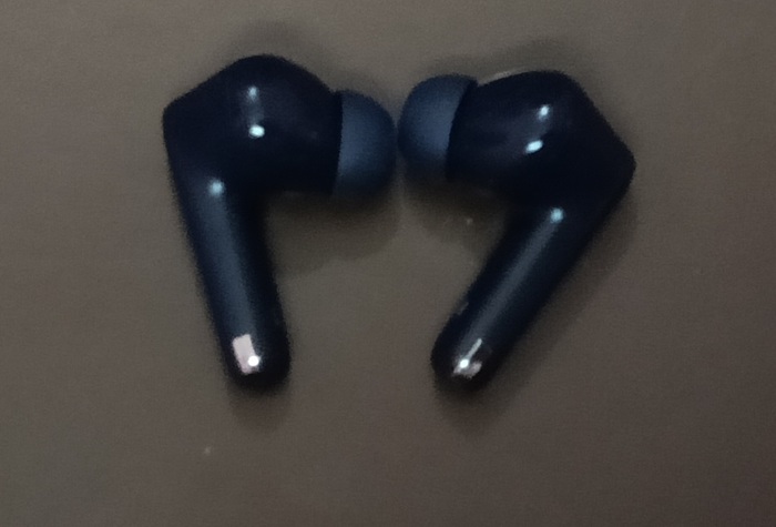 A pair of Bluetooth earbuds to be connected on Android phone.