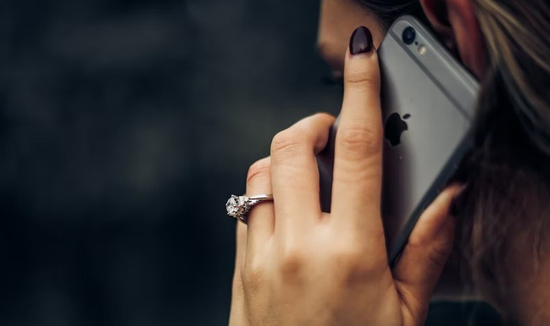 Woman talking on iPhone.