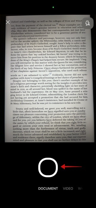 Tapping shutter button to scan document in OneDrive app on iPhone.