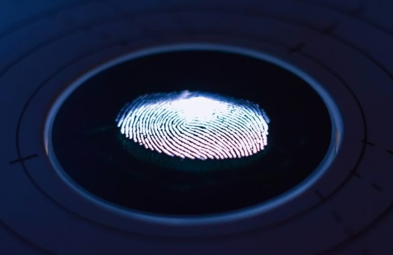Fingerprint on blue and black background.