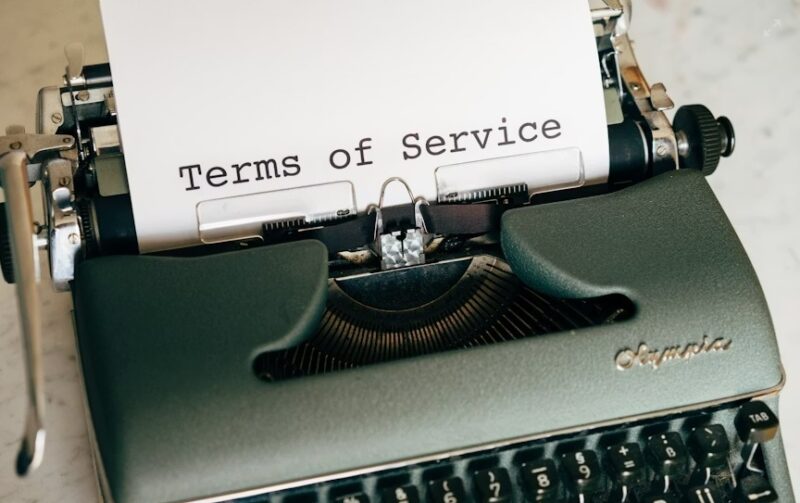 Typewriter with Terms of Service on paper.