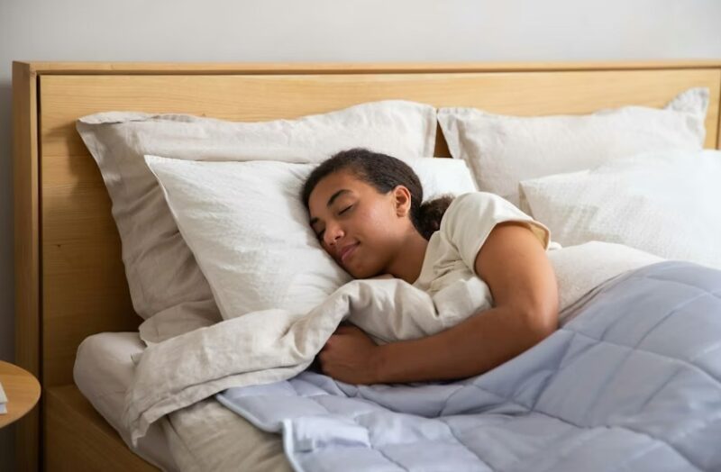 Woman asleep in bed.