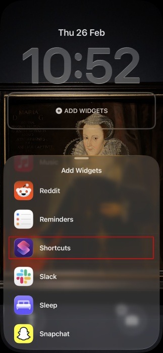 Selecting "Shortcuts" from "Add Widgets" menu on iPhone lock screen. 